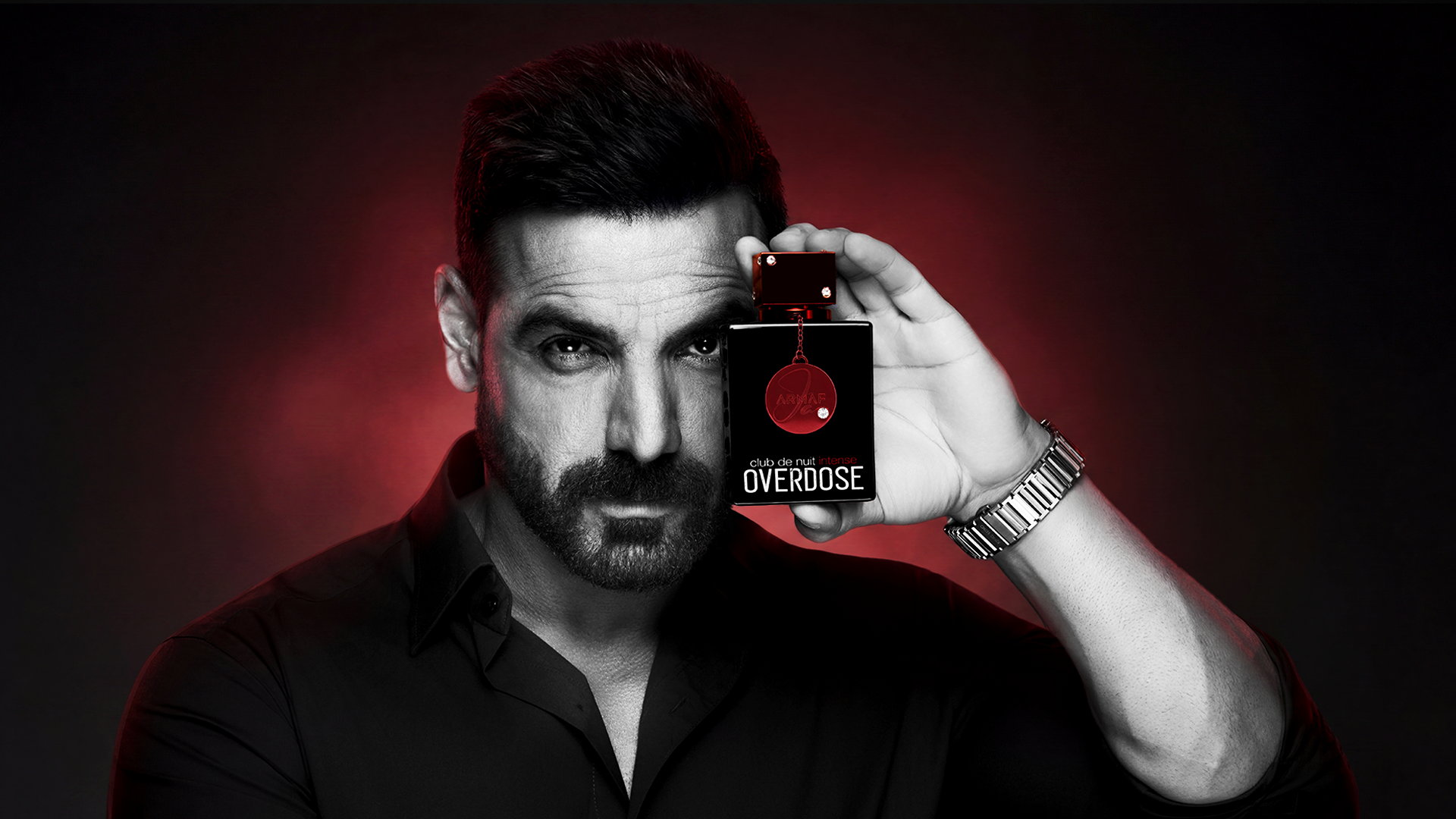 John Abraham holding Club de Nuit Intense Overdose